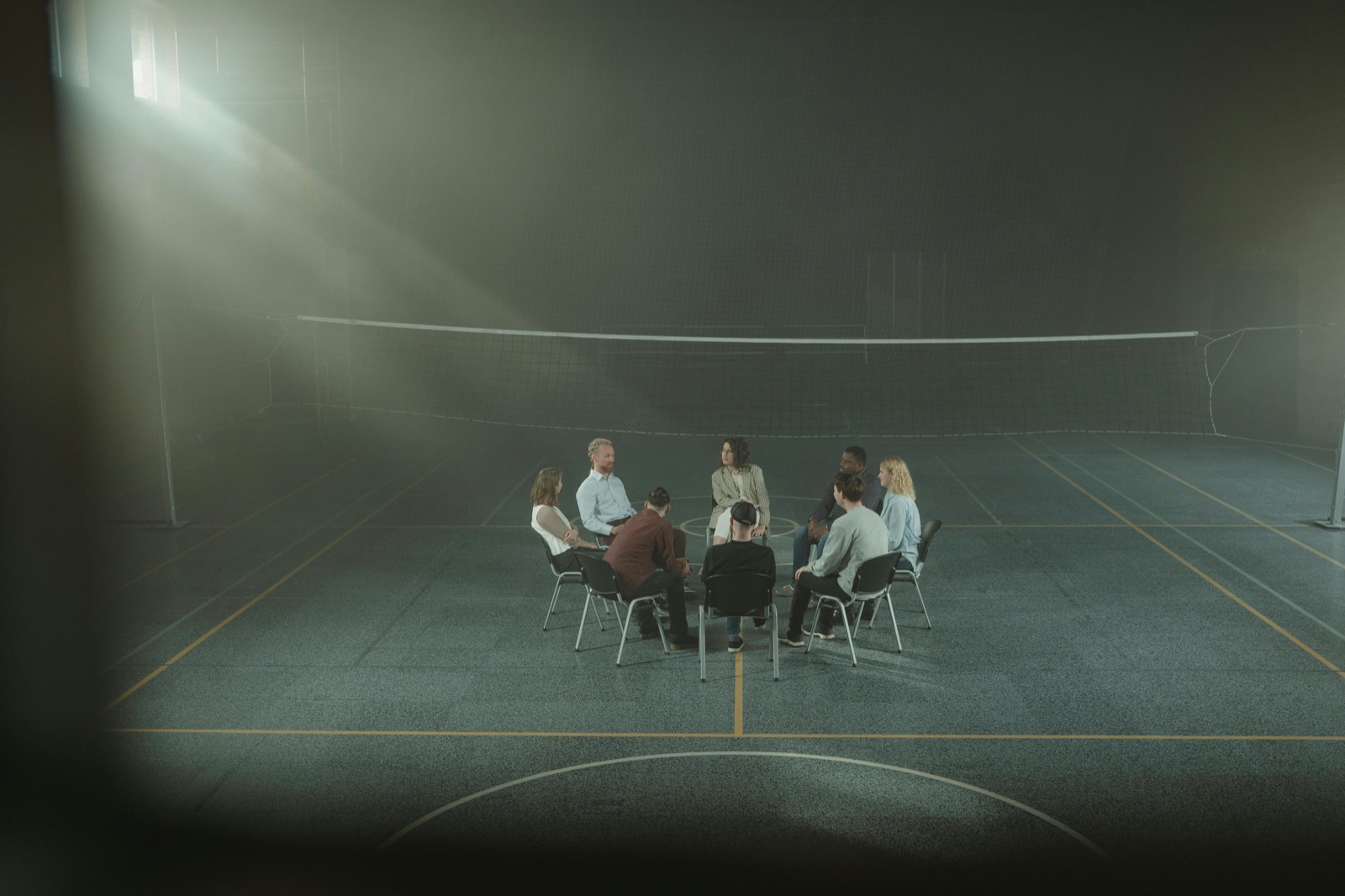 People seated together in a facilitated group circle
